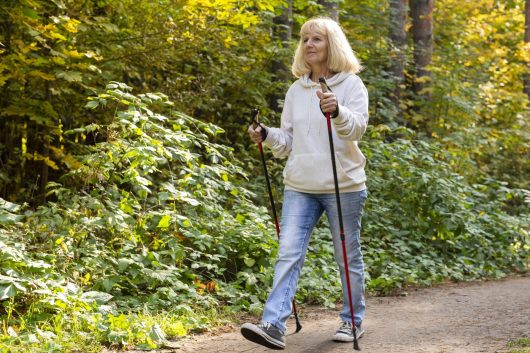 older-woman-trekking-outdoors